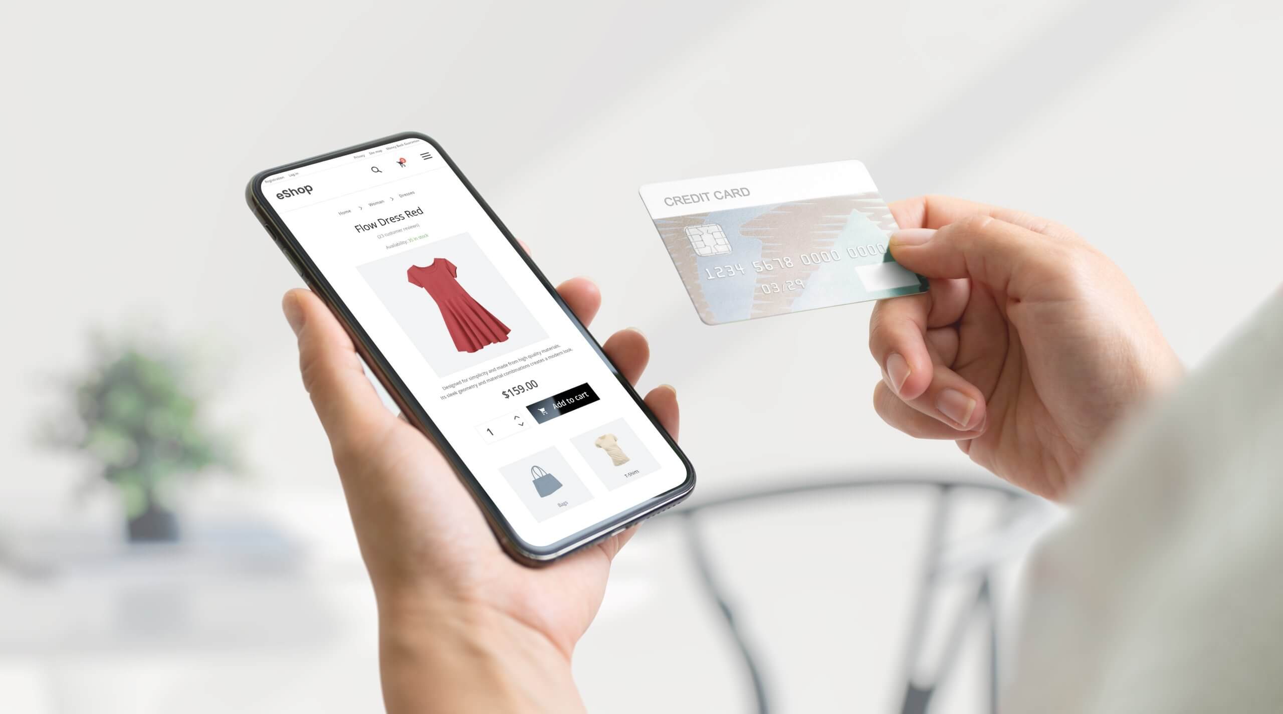 Shopping online with smart phone and credit card concept. Modern e-commerce web page with with women's clothing